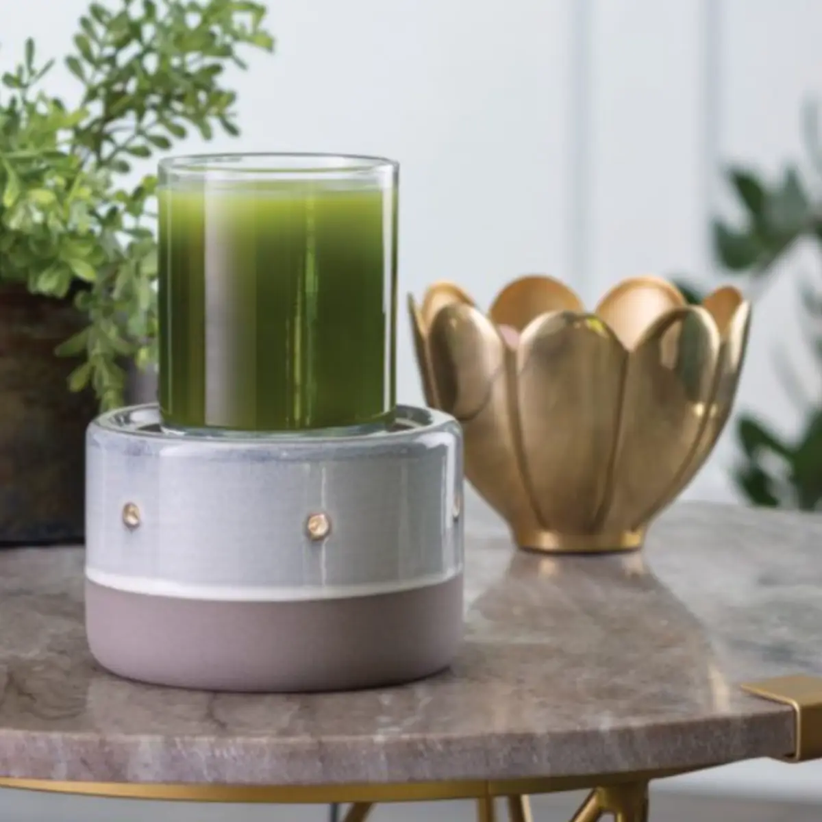 Blue glazed ceramic wax melt burner showing how it can be used as a candle warmer