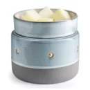 Ceramic wax melt burner with blue glazed finish and gold accents, holding fragrance wax cubes