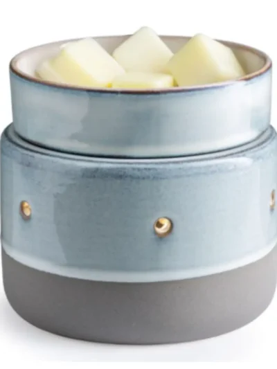 Ceramic wax melt burner with blue glazed finish and gold accents, holding fragrance wax cubes